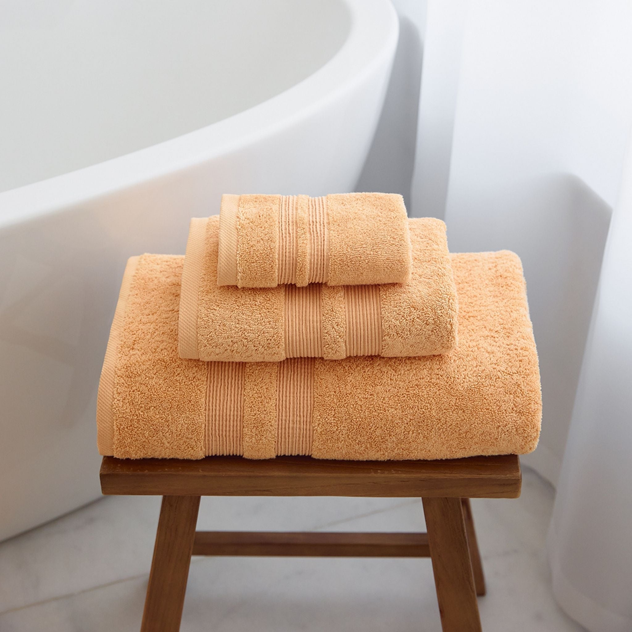 torres-novas-bath-elegance-plain-3-piece-towel-set-light-orange-lifestyle-2.jpg