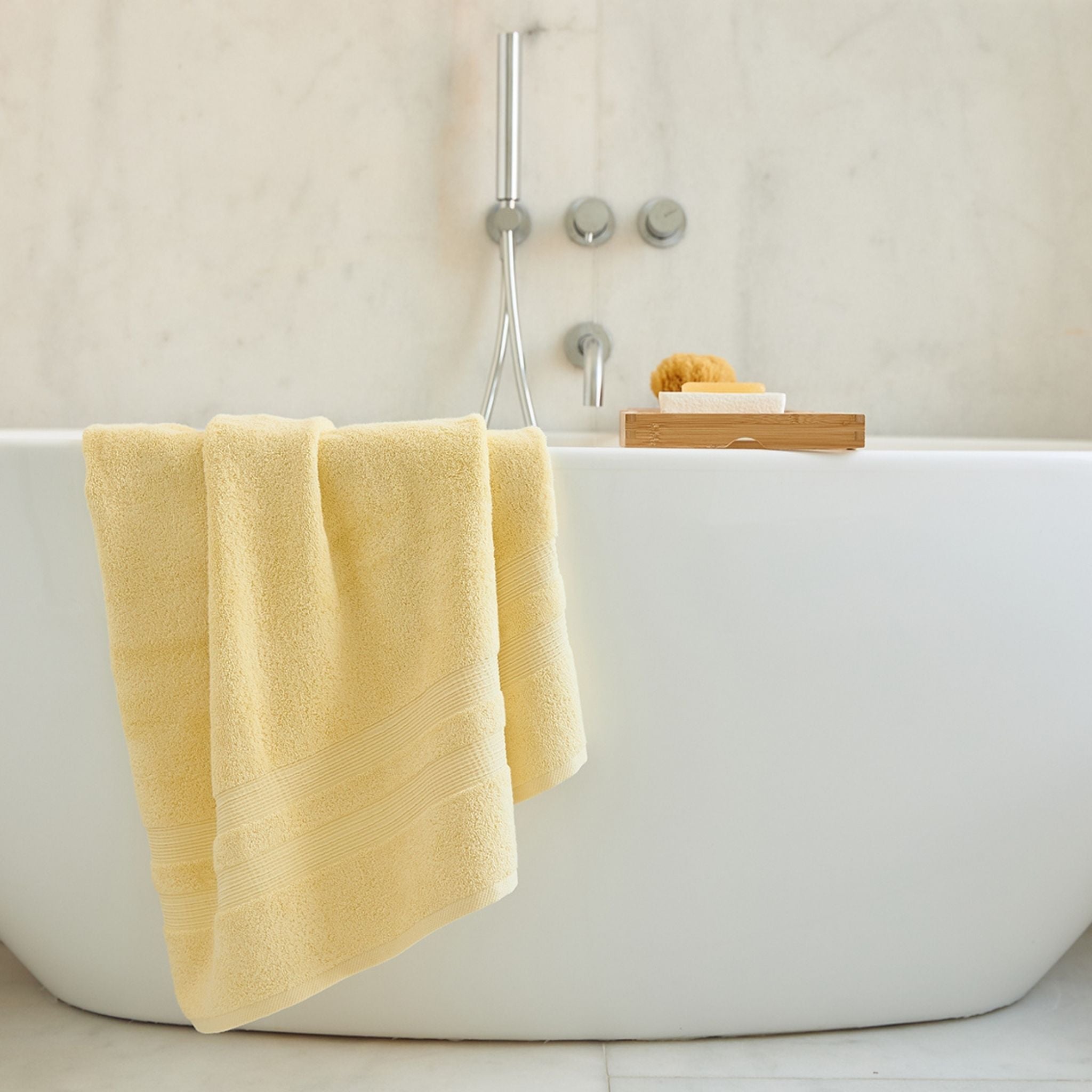 torres-novas-bath-elegance-plain-bath-towel-yellow-chic-lifestyle-1.jpg