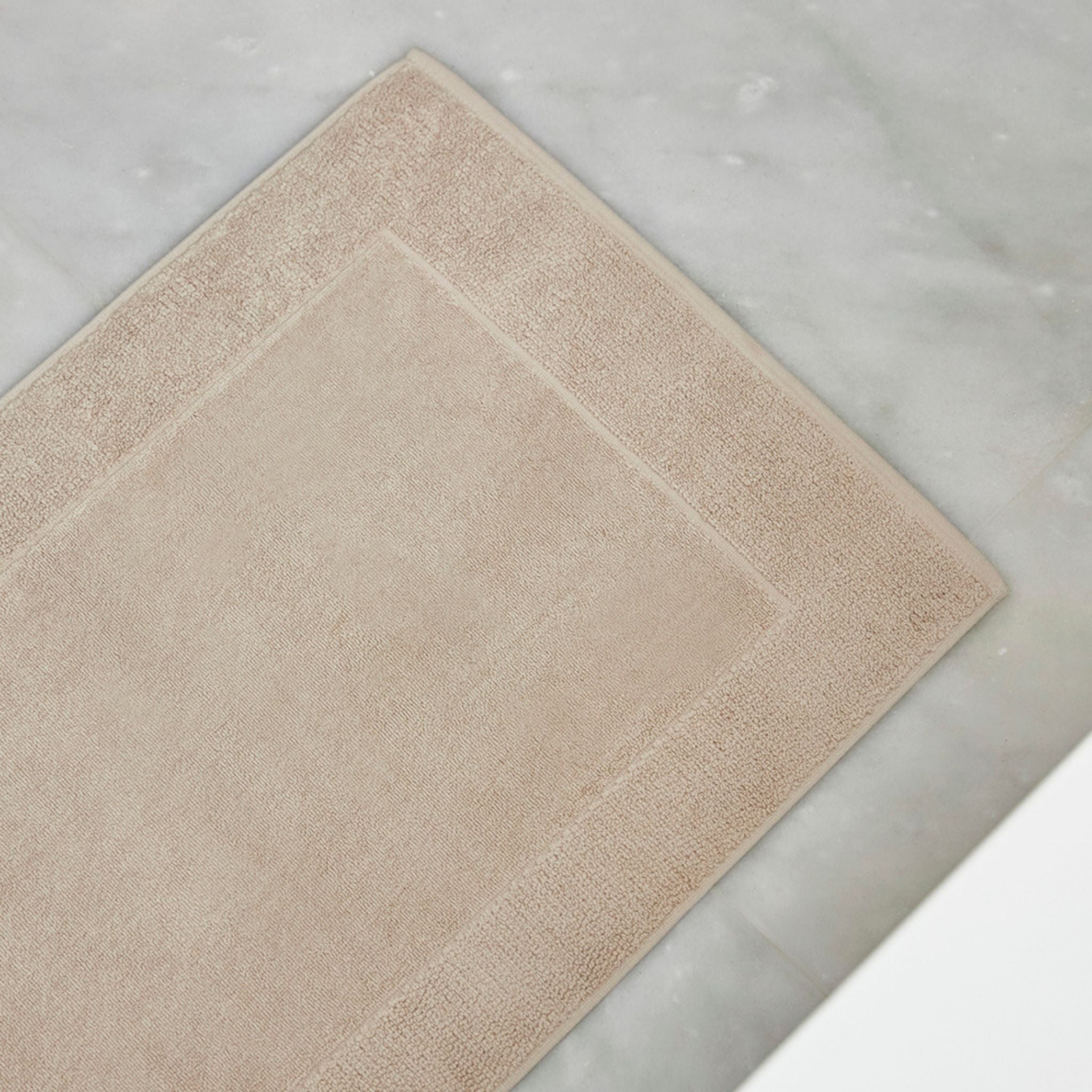 Beige bath mat