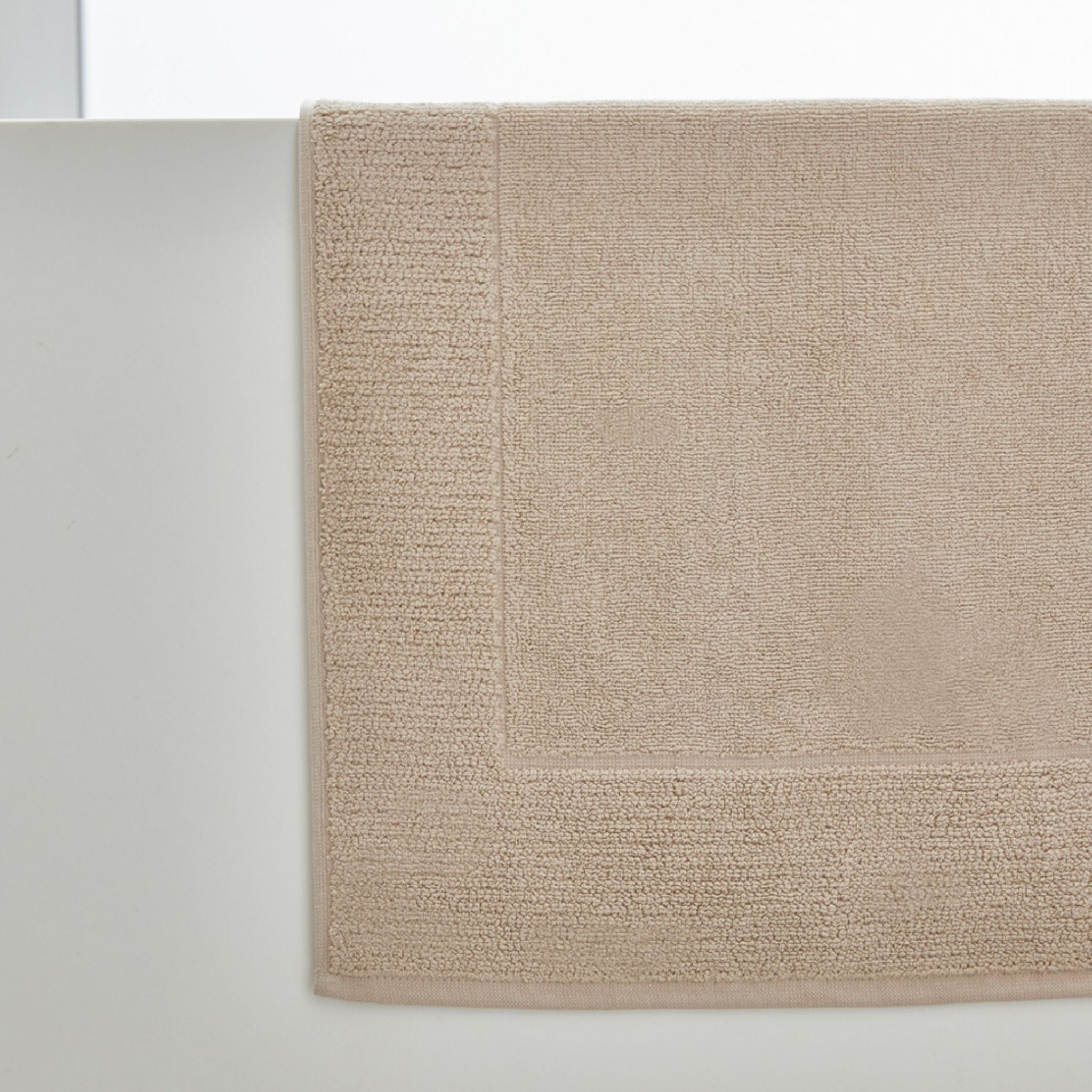 Beige bath mat