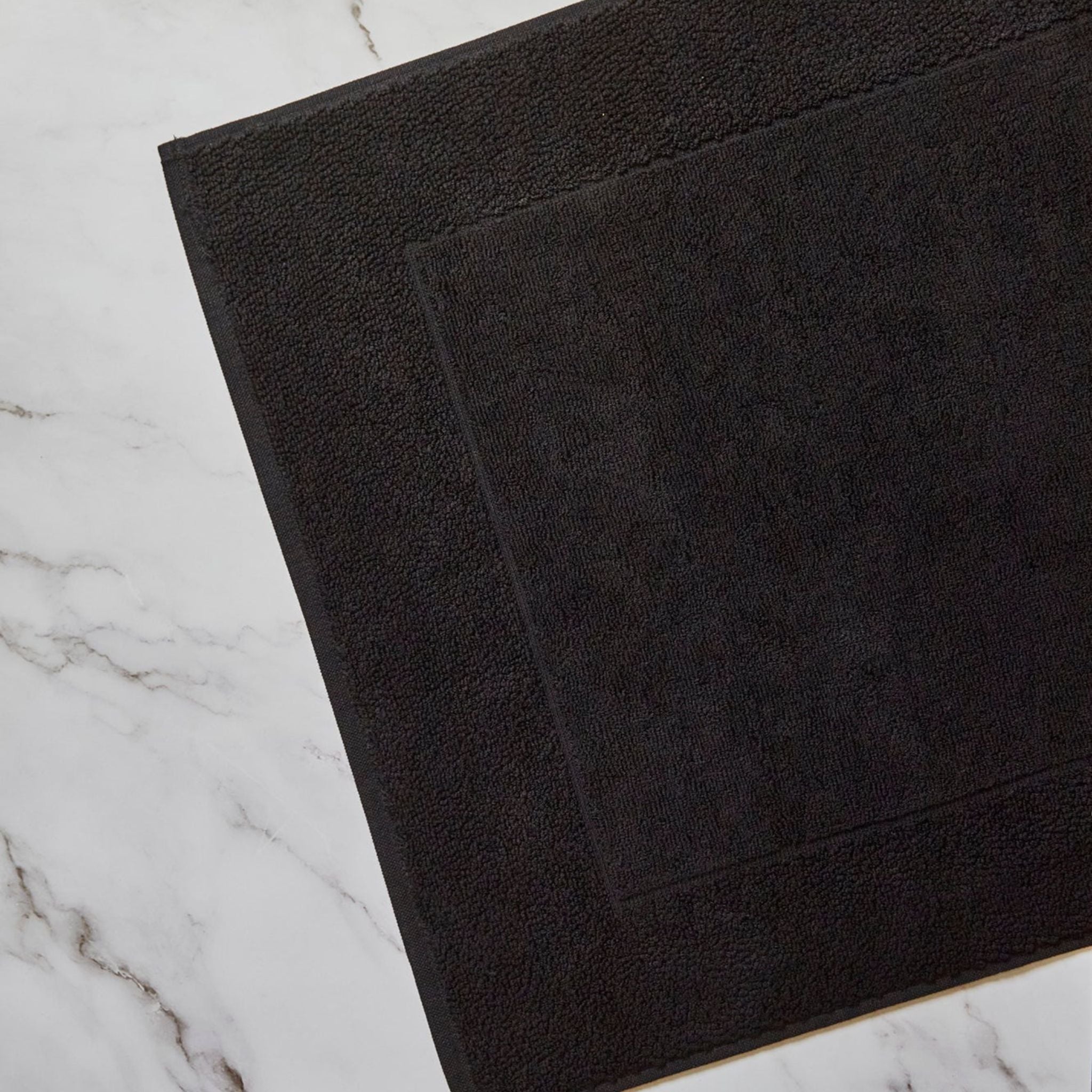 Caviar black bath mat