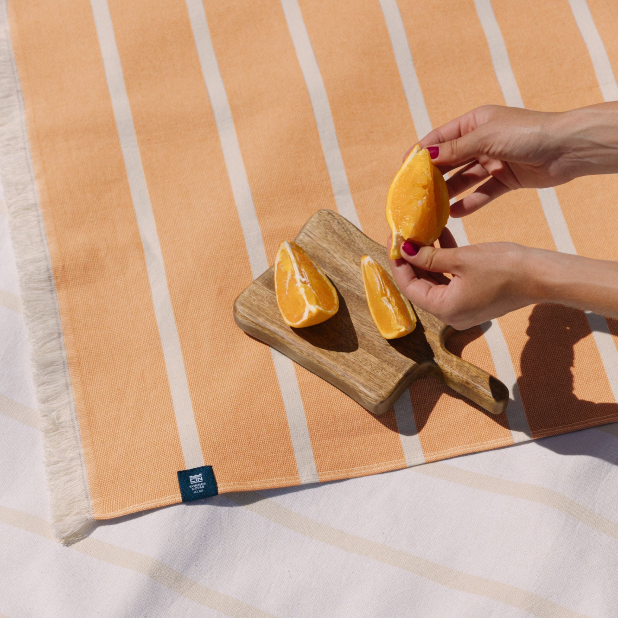 torres-novas-beach-belem-horizontal-stripes-towel-orange-lifestyle-2.jpg