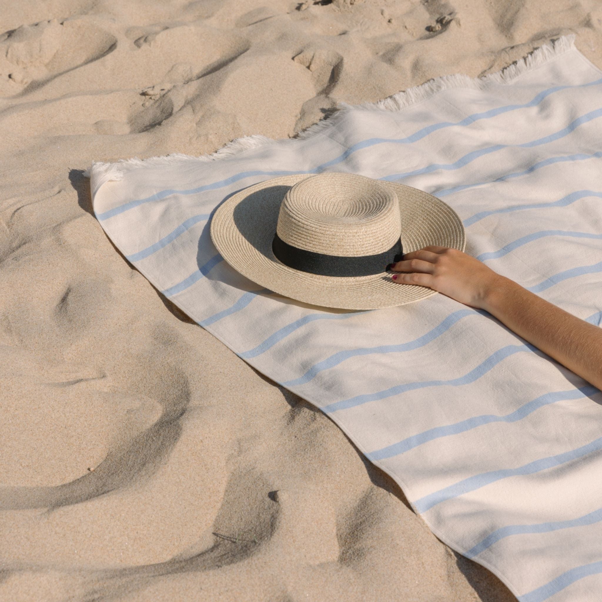 torres-novas-beach-boa-nova-horizontal-stripes-towel-blue-sky-lifestyle-2.jpg