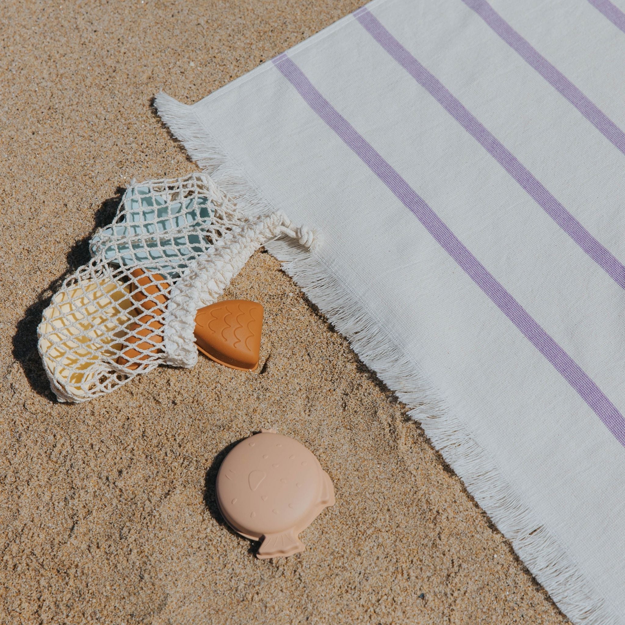 torres-novas-beach-boa-nova-horizontal-stripes-towel-lavender-lifestyle-2.jpg