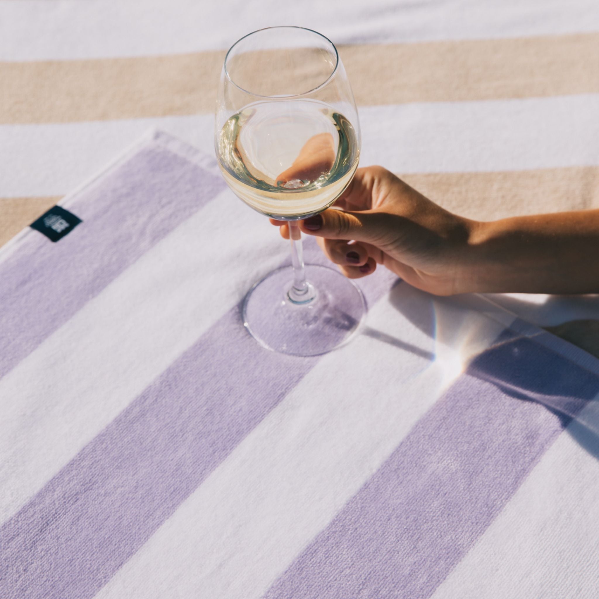 torres-novas-beach-gibalta-vertical-stripes-towel-lavender-lifestyle-2.jpg
