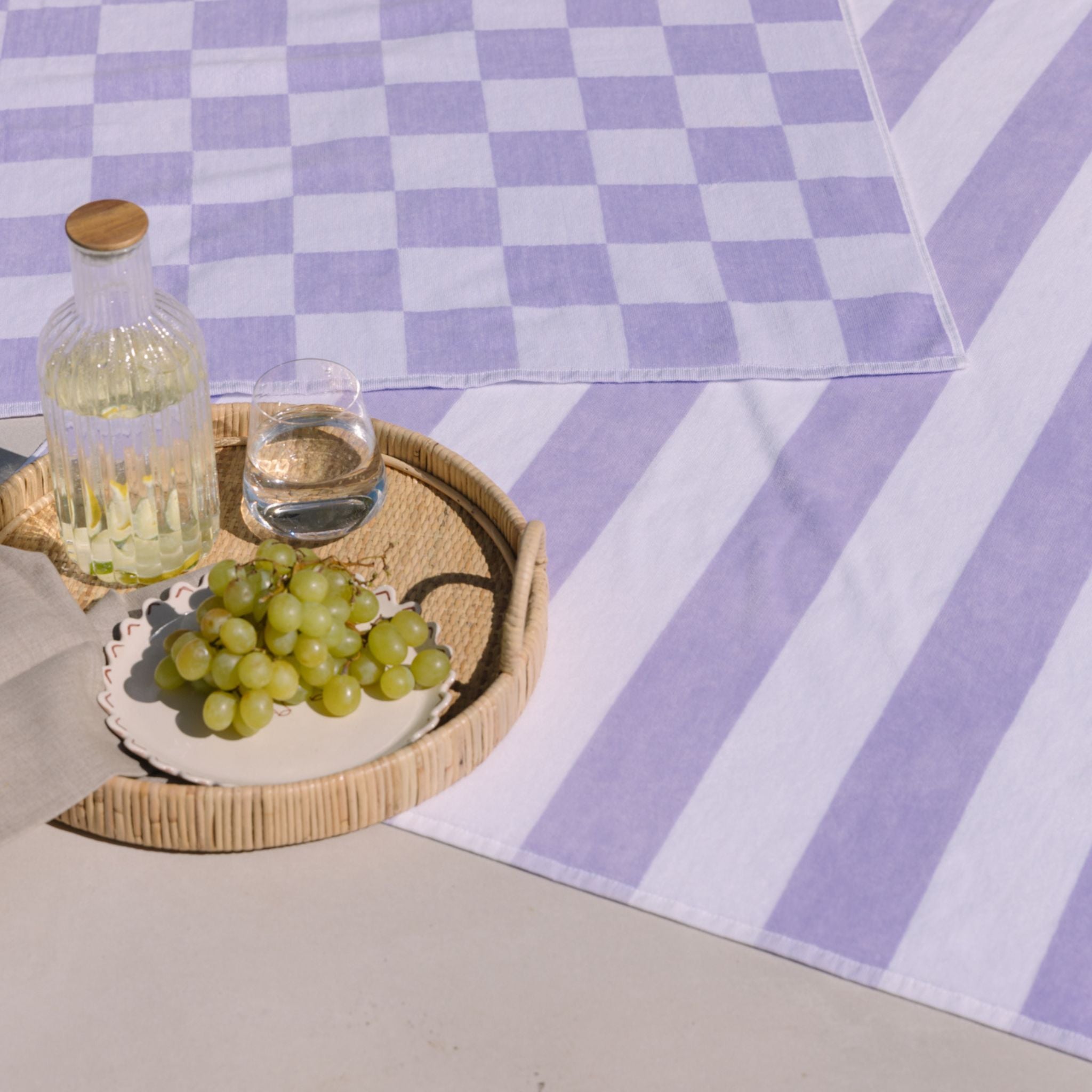 torres-novas-beach-gibalta-vertical-stripes-towel-lavender-lifestyle-4.jpg