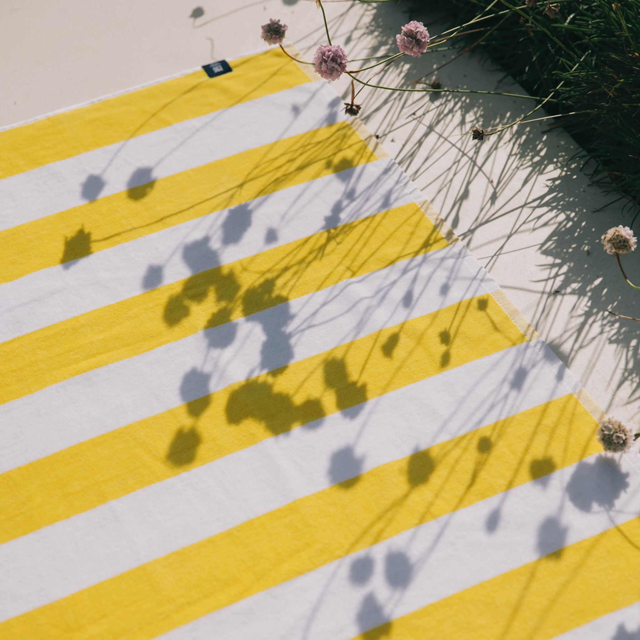 torres-novas-beach-gibalta-vertical-stripes-towel-yellow-lifestyle-1.jpg