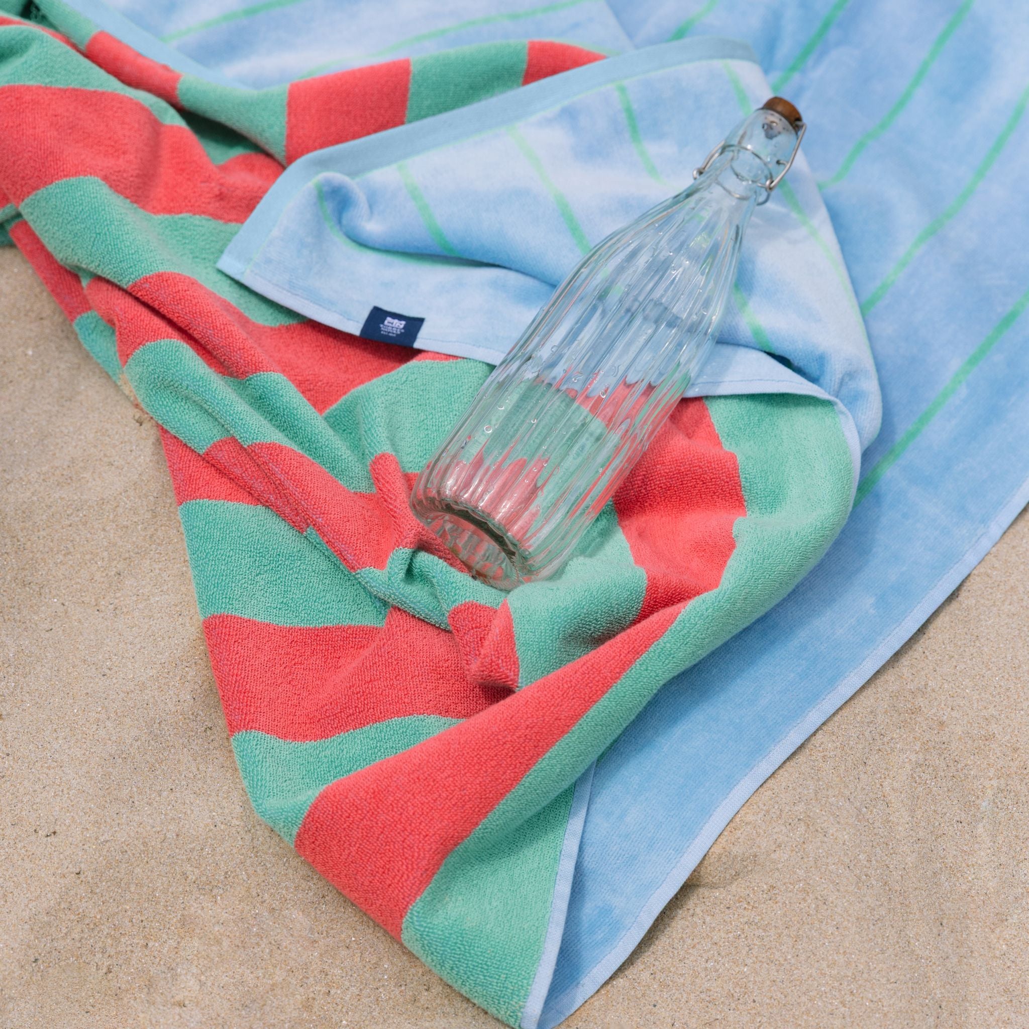 torres-novas-beach-pena-vertical-stripes-towel-green-lifestyle-1_b605f35f-28c3-4171-8ed8-4e15acb9b057.jpg