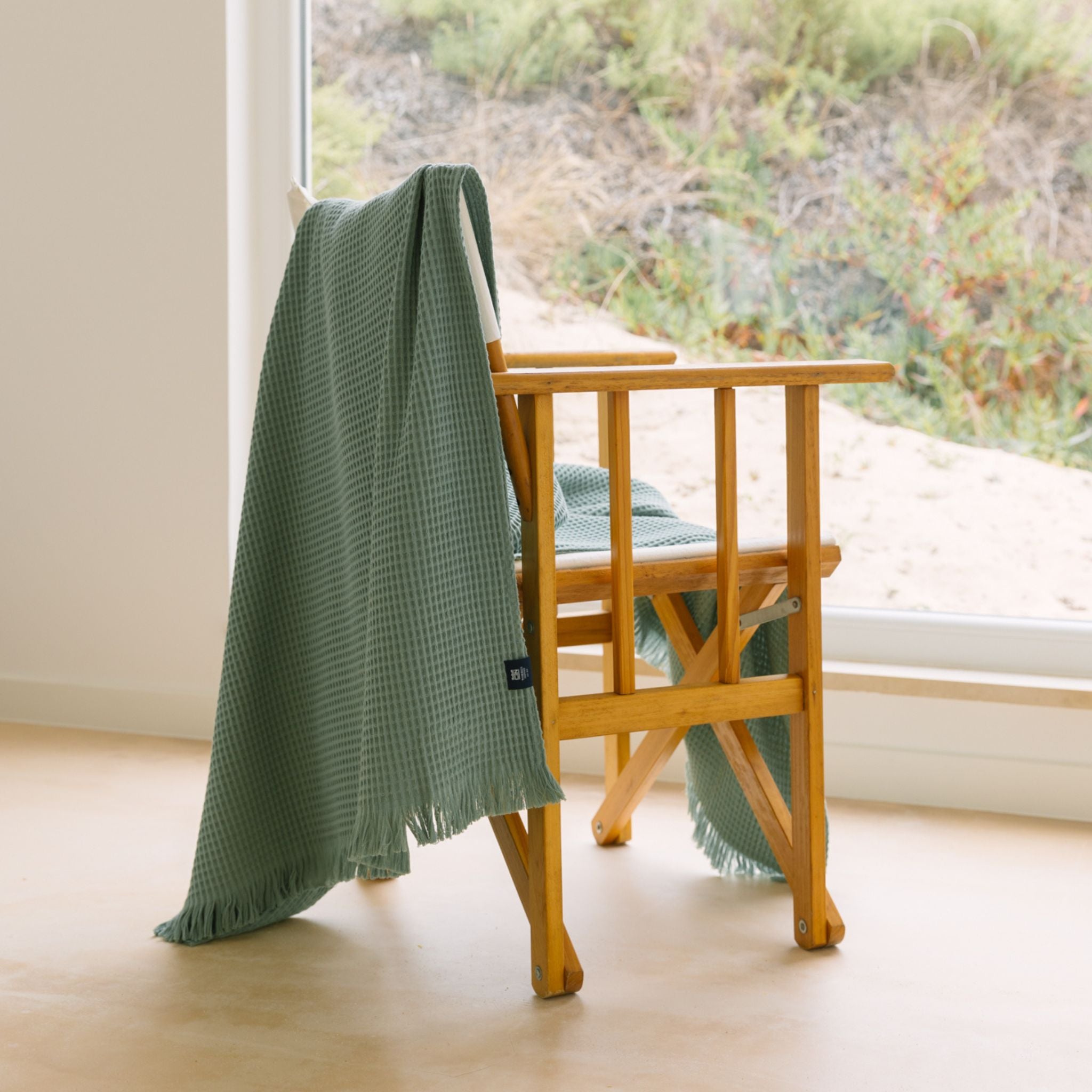 torres-novas-beach-santana-waffle-towel-green-lifestyle-2_81d05645-7f0b-4cf4-86ab-31dc36665779.jpg