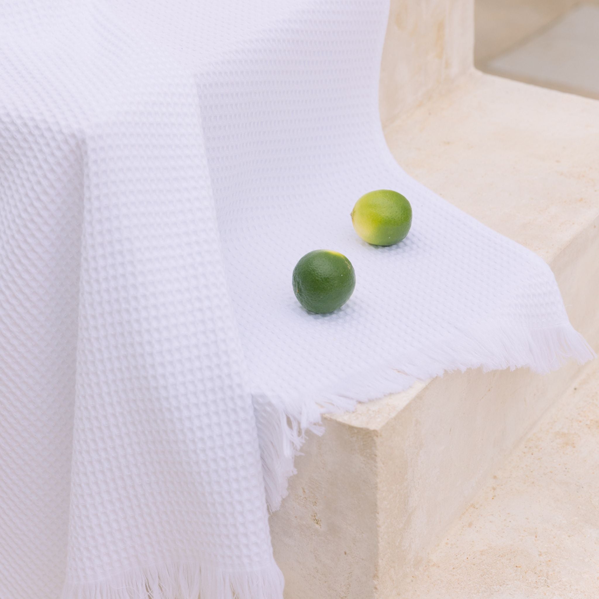 torres-novas-beach-santana-waffle-towel-white-lifestyle-1_00871db5-62ce-42de-a95e-accc90d1269d.jpg