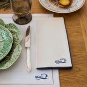 Nazaré ecru cotton table linen with embroidered Portugal-inspired motifs