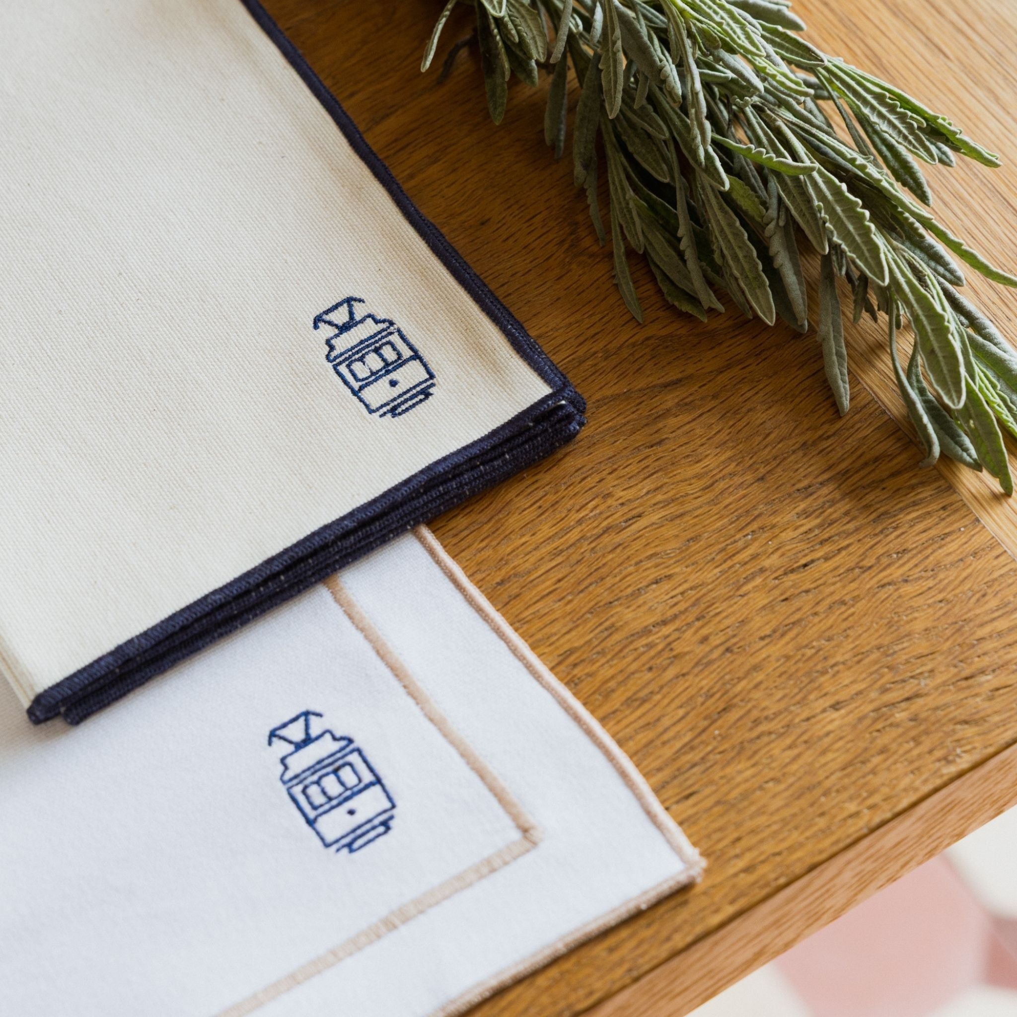 Nazaré ecru cotton table linen with embroidered Portugal-inspired motifs