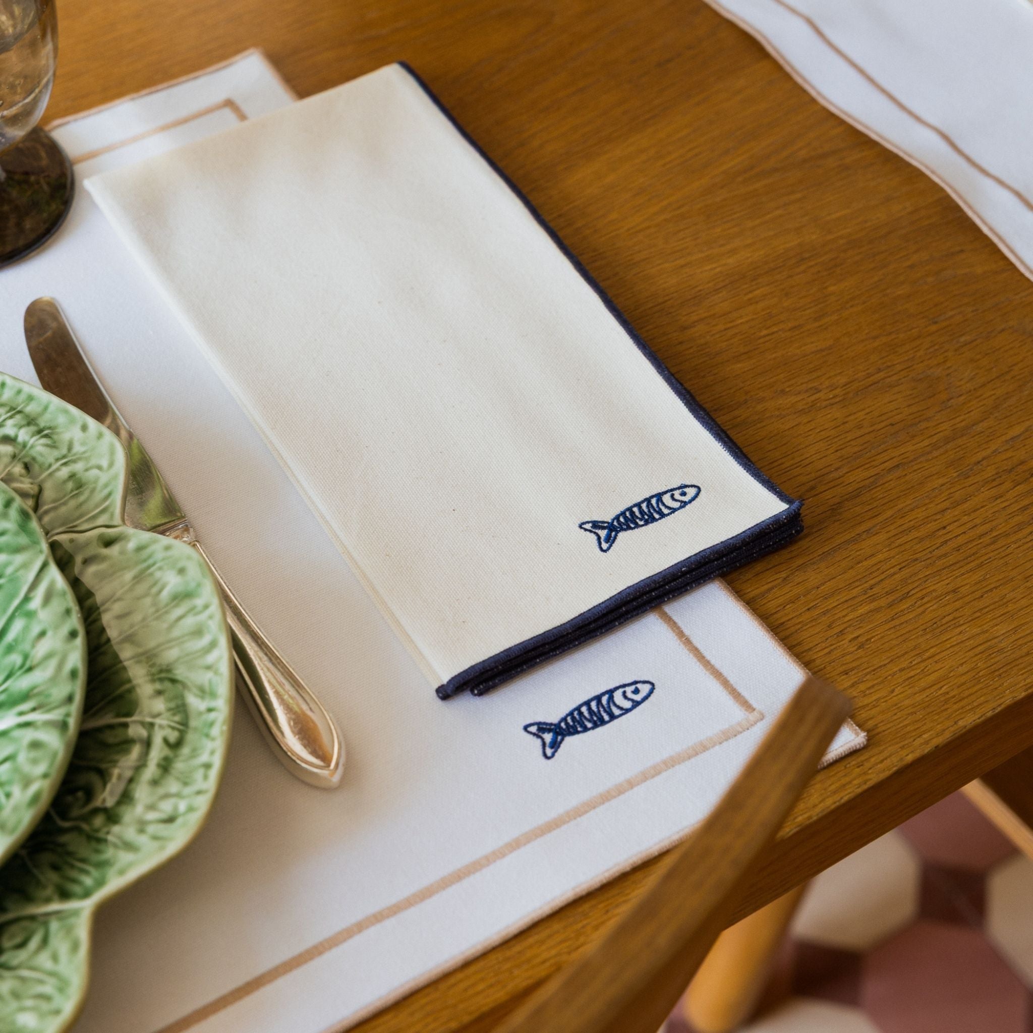 Nazaré ecru cotton table linen with embroidered Portugal-inspired motifs
