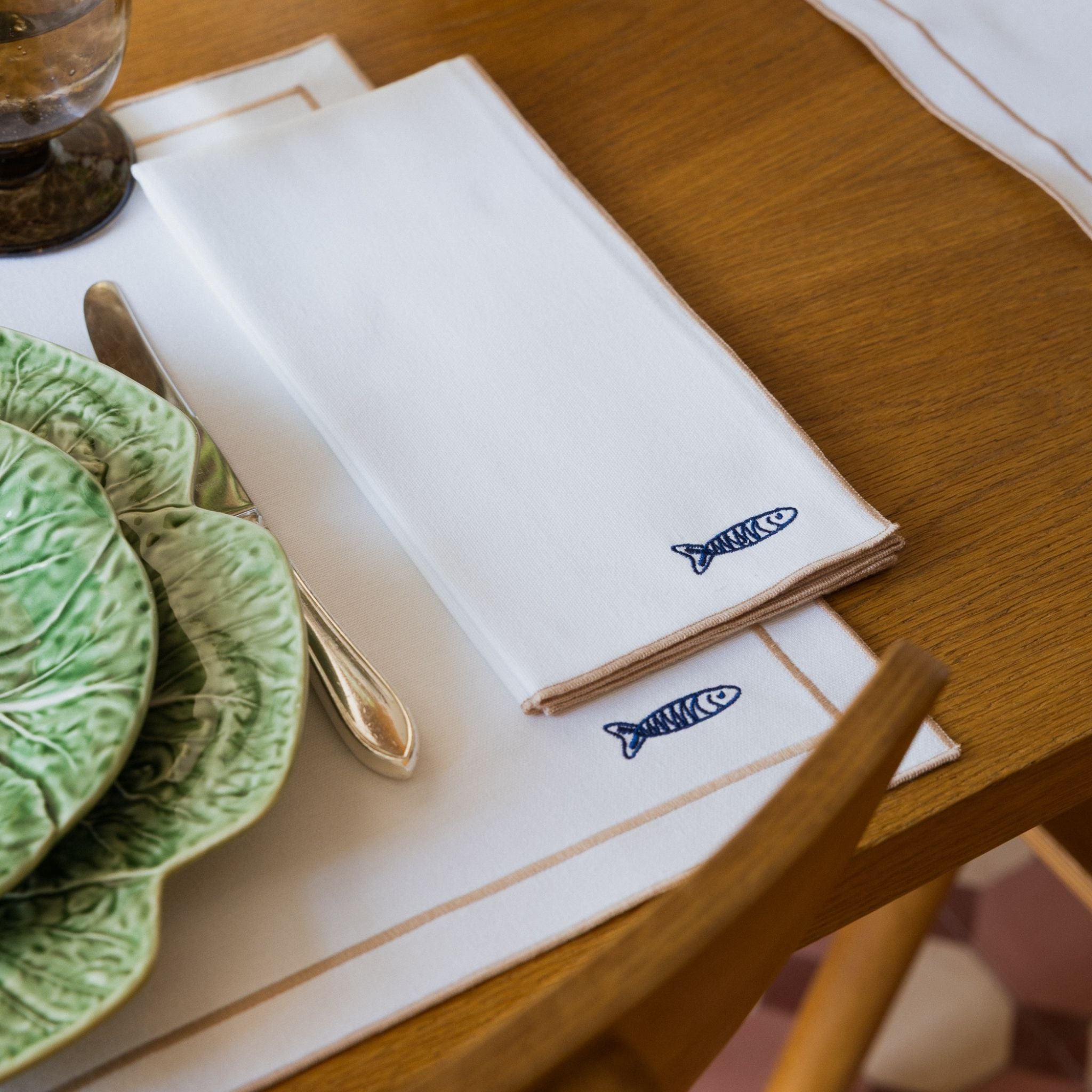 Nazaré white cotton table linen with embroidered Portugal-inspired motifs