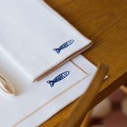 Nazaré white cotton table linen with embroidered Portugal-inspired motifs