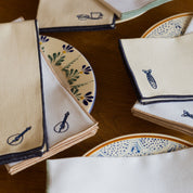 Nazaré ecru cotton table linen with embroidered Portugal-inspired motifs