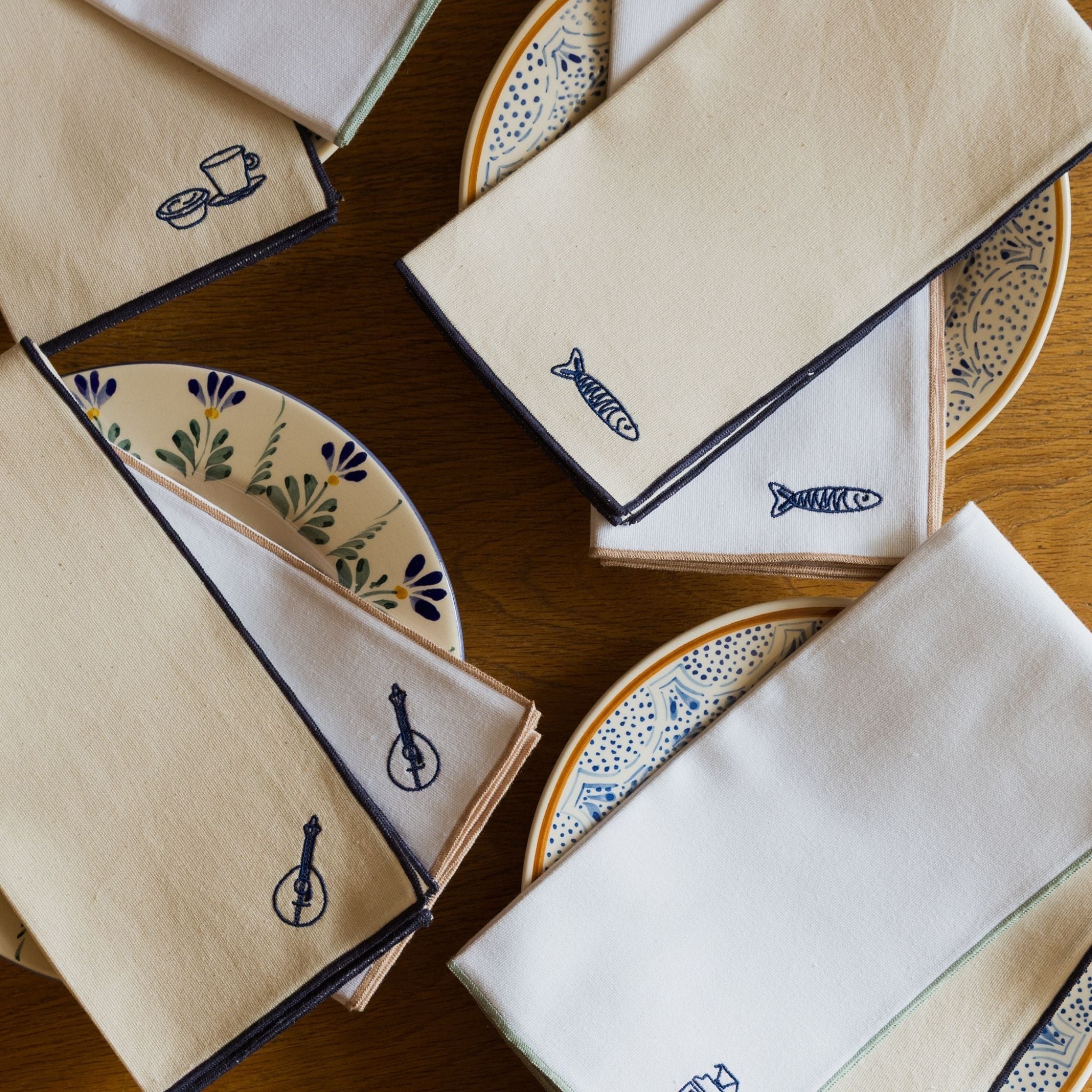 Nazaré ecru cotton table linen with embroidered Portugal-inspired motifs